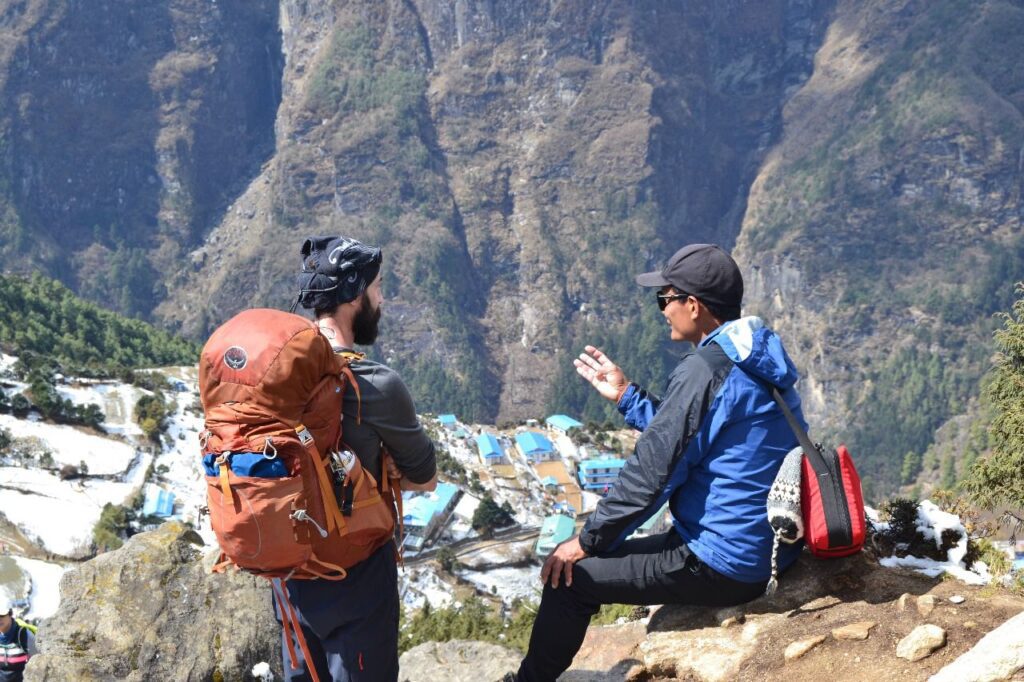 Talk between guide and clients on the top of Lukla